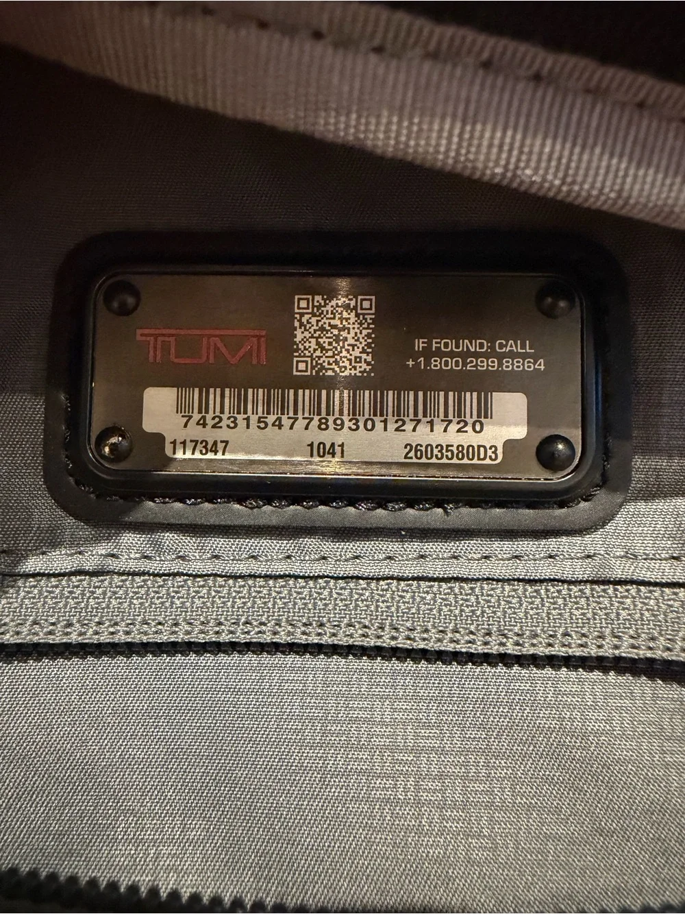 Tumi Black Backpack with Multiple Front Pockets